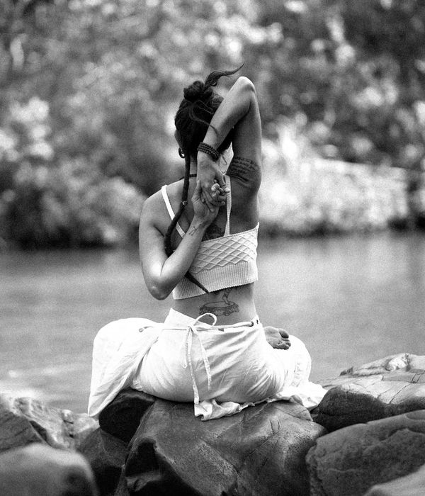 Woman in a calm yoga pose, embodying inner peace and balance.